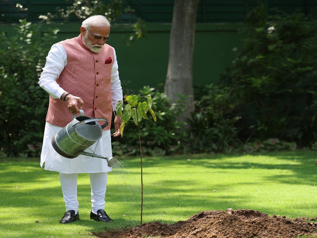 Prime Minister plants sindoor sapling at his residence in New Delhi on World Environment Day, pic credit- @narendramodi